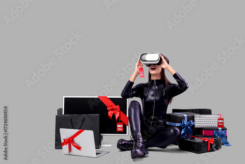 Young woman in VR glasses w...