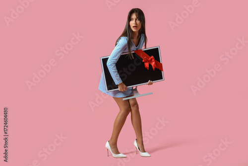 Shocked young woman with mo...