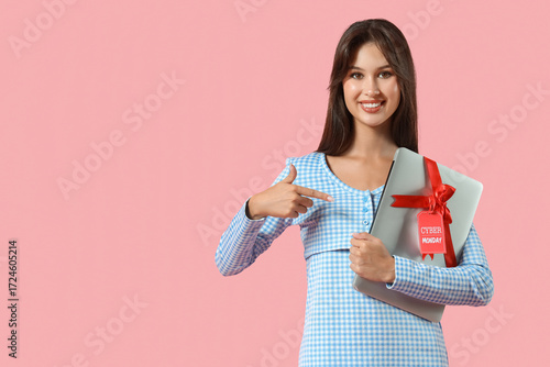 Young woman pointing at lap...