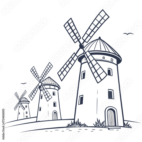 Three traditional windmills stand tall on a grassy hill under a clear sky with birds flying overhead
