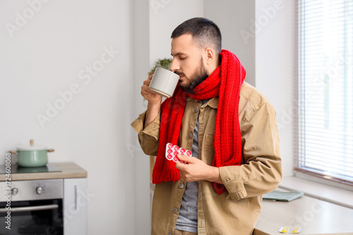 Ill young man with throat l...