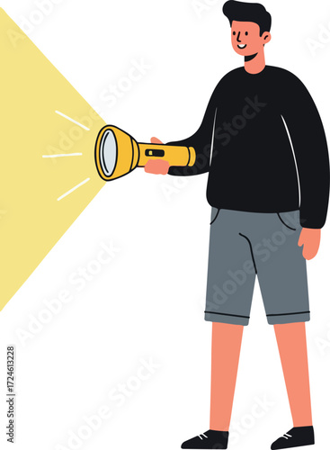 Man holding a flashlight illuminating the darkness with bright light.