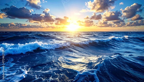 Ocean Horizon and Coastline with Sunset Reflections and Calm Sea Waves