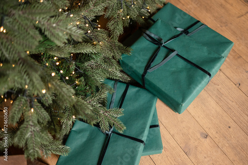 Wallpaper Mural Christmas presents in green packaging under the tree Torontodigital.ca