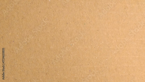 Background of brown kraft paper or cardboard texture. Abstract pattern of beige rough carton, old paper sheet.