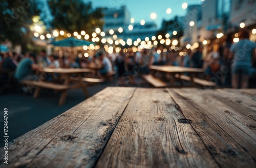 Rustic wooden table at a city street fair at twilight