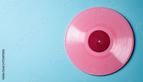 Pink vinyl record on a light blue background (1)