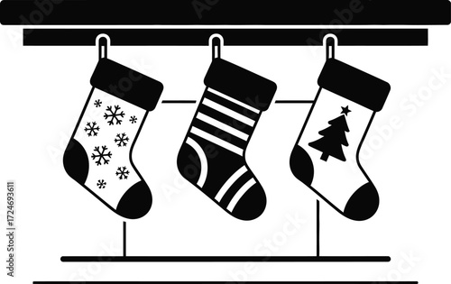 Three festive Christmas stockings hung on a mantelpiece, ready for gifts