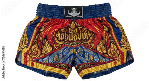 Muay Thai shorts with intricate Thaiinspired designs combining red blue and gold colors