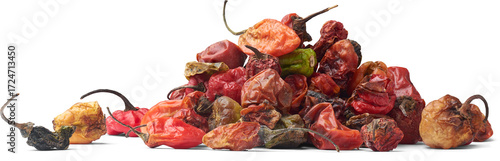 pile of overripe chili peppers isolated white background, side view of discarded vegetable in side view, agricultural sustainability and renewal concept
