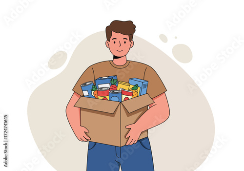 Smiling man holding a cardboard box filled with various food items, representing food donation or charity.