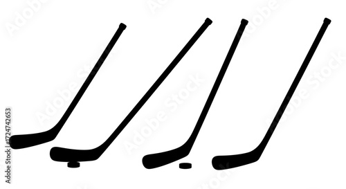 Four hockey sticks and pucks in motion representing game play and sports activity vector
