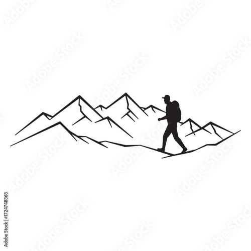 Silhouette of a hiker walking across a mountain range
