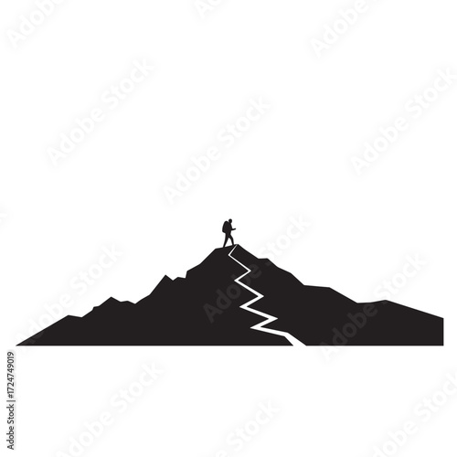 Silhouette of a lone hiker on a mountain peak with a winding path