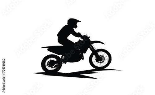 Motocross Rider Silhouette Leaning into a Turn on a Dirt Bike