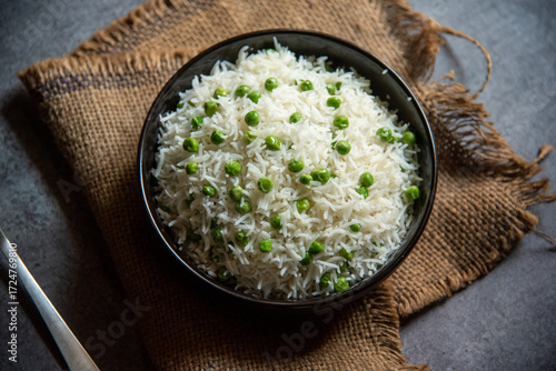 Matar pulao or basmati rice prepared with peas served in a bowl. Close up, selective focus.