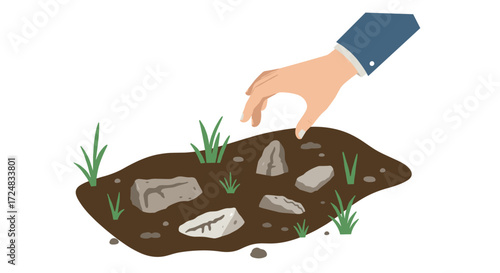 Hand reaching for stones in soil with grass sprouts