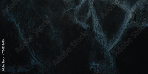 Abstract cracked stone texture with blue and gray tones, ideal for backgrounds, overlays, and creative design projects.