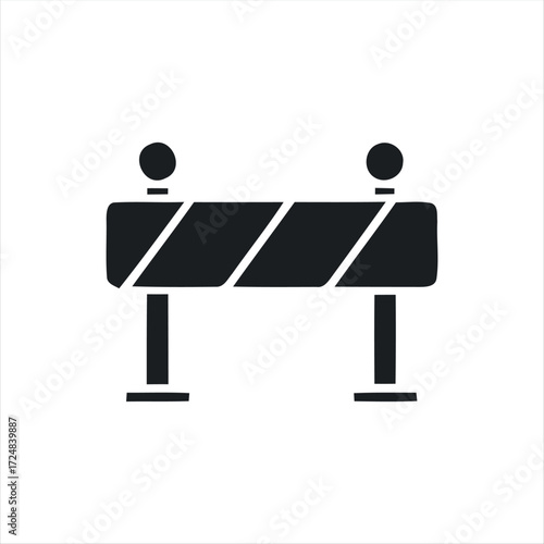 Black glyph roadblock icon with white background. Minimalist vector illustration of traffic barrier, perfect for road construction, warning signs, safety, and transportation des