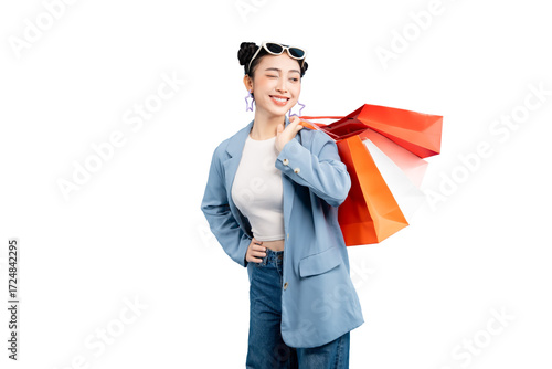 portrait Asian Woman  holding shopping bags while smiling and enjoying her shopping experience. She is fashionable, and radiating happiness on PNG
