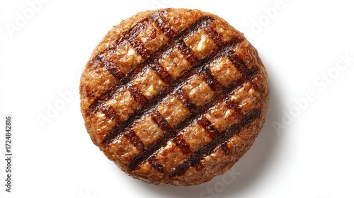 A juicy grilled burger patty, shown from above, set against a plain white backdrop.
 