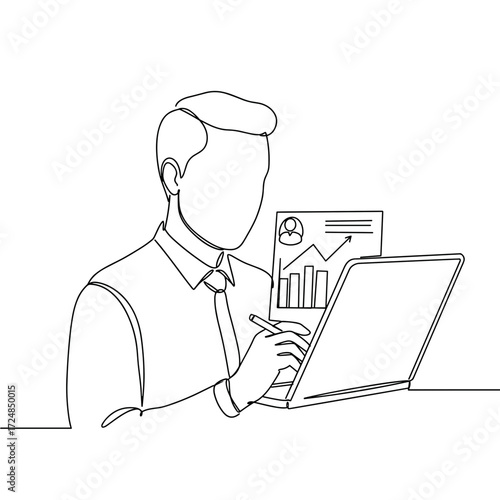 Businessman analyzing data on a laptop while taking notes  