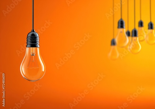 Hanging lightbulbs, one in focus, against an orange gradient background. Multiple lights blurred in the background. Simple and conceptual
