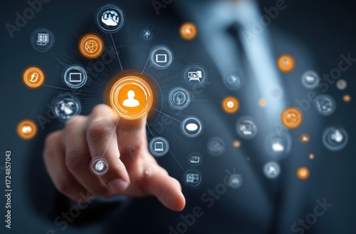 Hand touches orange icon within a network of interconnected symbols, representing digital interactions, connectivity, and modern communication