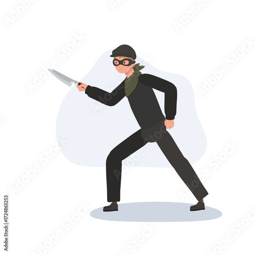 a robber thief in black clothing holding knife showing criminal