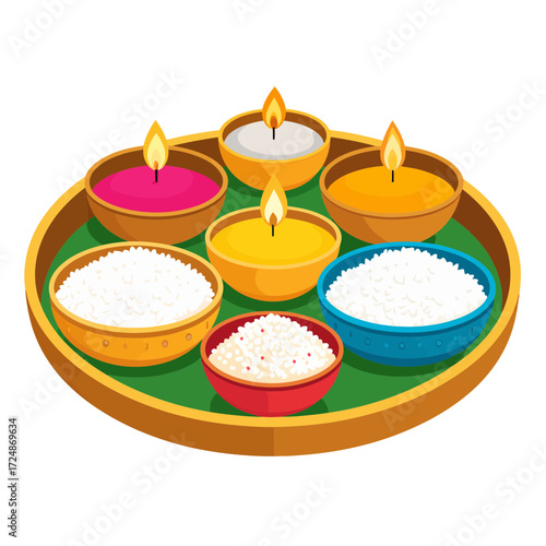 Decorative pooja thali tray holds lit candles and colorful bowls filled with rice for Hindu festival ritual.