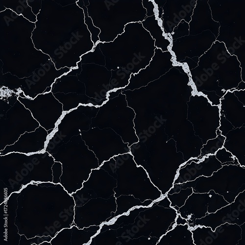 Close-up view of a dark surface with intricate white crack patterns resembling lightning.