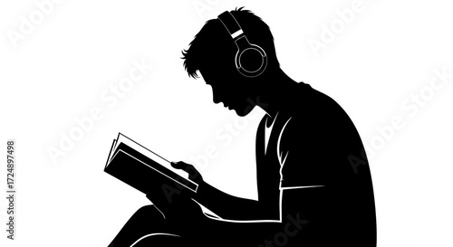 Contemplative Silhouette of a Male Teenager Deeply Engrossed in Reading a Physical Book