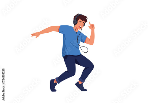 A young man, joyful, dances while listening to music through headphones.