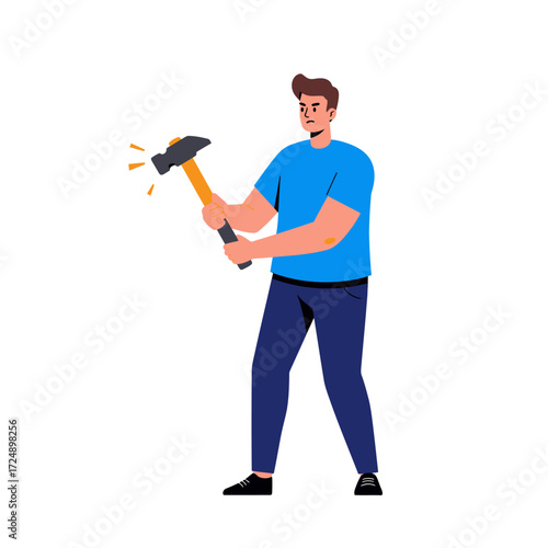 A man in a blue shirt holding a hammer, appearing to swing it with force.