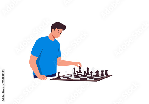 A young man in a blue shirt thoughtfully moves a chess piece on the board.