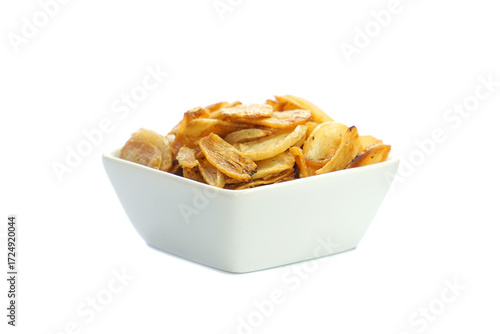 Фотография Allium Sativum, fried garlic, thinly sliced golden yellow frame For decorating f