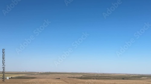 Scenic drive through Alberta, Canada farmland with wide open prairie nature and rural countryside agriculture views captured from a driver’s point of view.