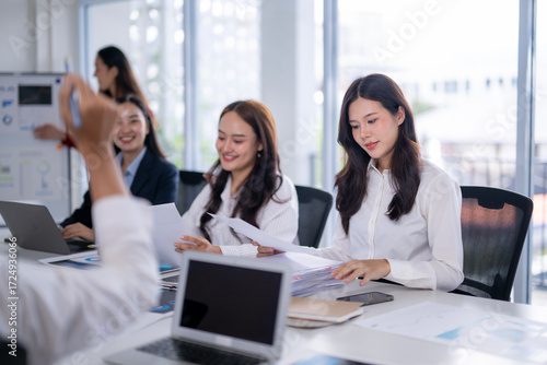 Free Download Businesswomen working together on project in modern office meeting room - GFXLoad