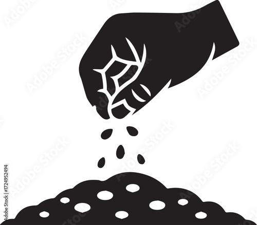 Farmer's hand sowing seeds into fertile soil for growth and agriculture concept