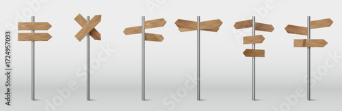 Wooden arrow signposts on metal pole with directional boards for rustic wayfinding and outdoor navigation. Trail markers with or pointer planks for parks and camping areas. Timber guidance system.