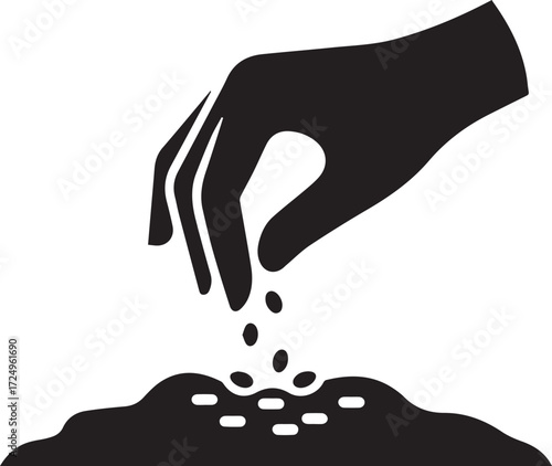 Silhouette of a hand planting seeds in fertile soil symbolising growth agriculture and new beginnings