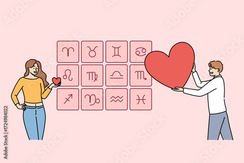 Love horoscope is used by woman to select sexual partner or future husband, standing near signs of zodiac with heart. Girl studies forecast of love horoscope before going on date with boyfriend