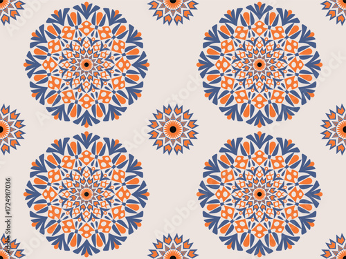This mandala pattern features bold orange and deep blue floral-like motifs arranged symmetrically. The circular design radiates harmony and balance, creating a lively yet elegant textile impression.