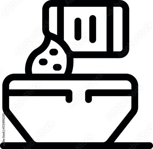 Ground spices pouring from a spice jar into a bowl, adding flavor and aroma to culinary creations