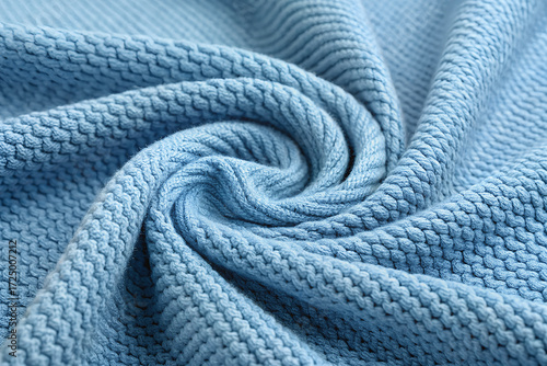 Textured Blue Fabric: Capturing the interplay of light and shadow across the unique pattern of a blue fabric, highlighting its softness, texture, and inherent design.