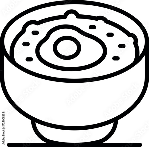 Hot bowl of oatmeal porridge with egg yolk served for breakfast, healthy morning meal