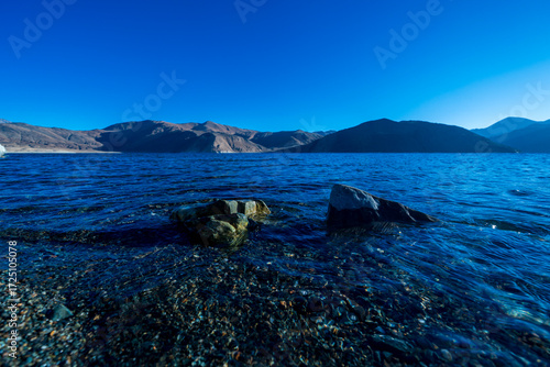 Beautiful rocky beach in Pangong Lake, the highest lake in the world, Ladakh, India.