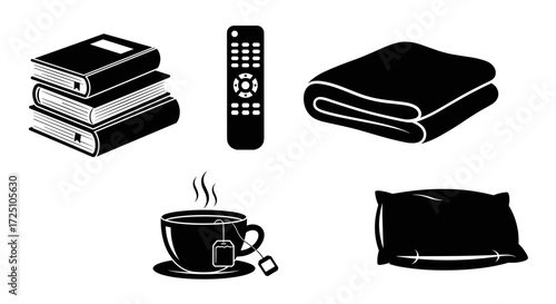 Stack of books, remote control, blanket, cup of tea, and pillow