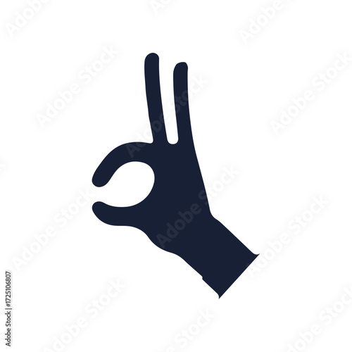 A hand gesture symbolizing approval against a plain background, representing positivity
