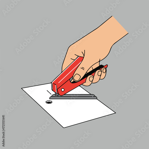 Red hole puncher tool held by a human hand pressing a paper sheet